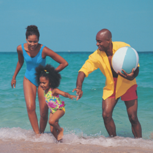 Family happily playing on the beach