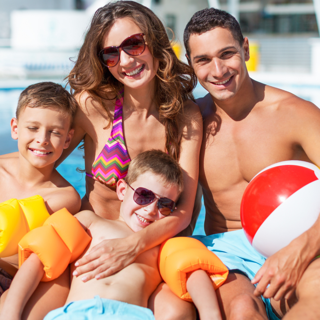 Happy family on vacation. Couple with two children on a family destination.